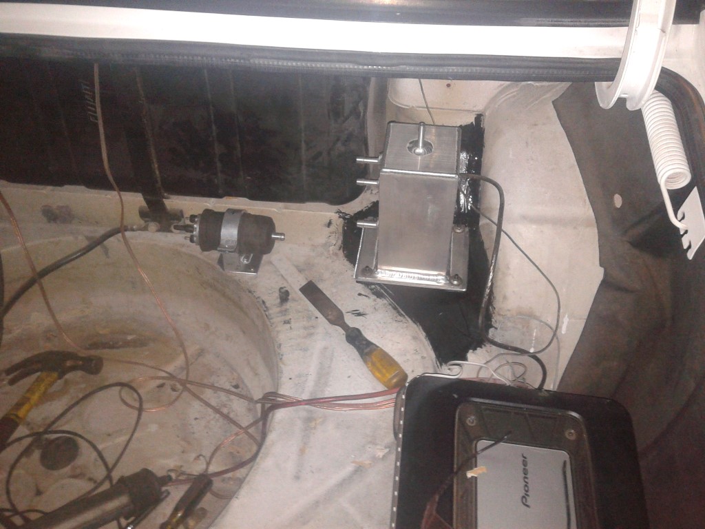surge tank mounted in boot