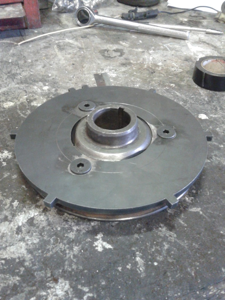 Custom CNC cut trigger wheel bolted to back of  standard pulley